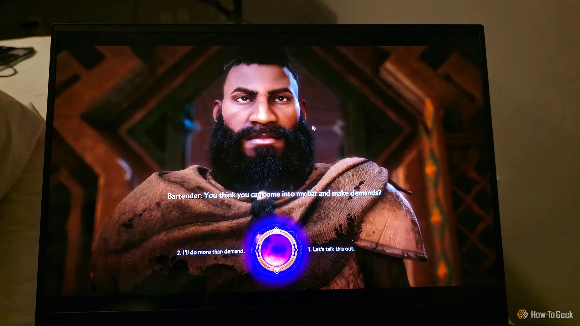 Mẫu laptop Razer Blade 16 2025 đang hiển thị game Dragon Age: The Veilguard, minh họa cho phần cốt truyện gây tranh cãi của một số game AAA hiện nay.