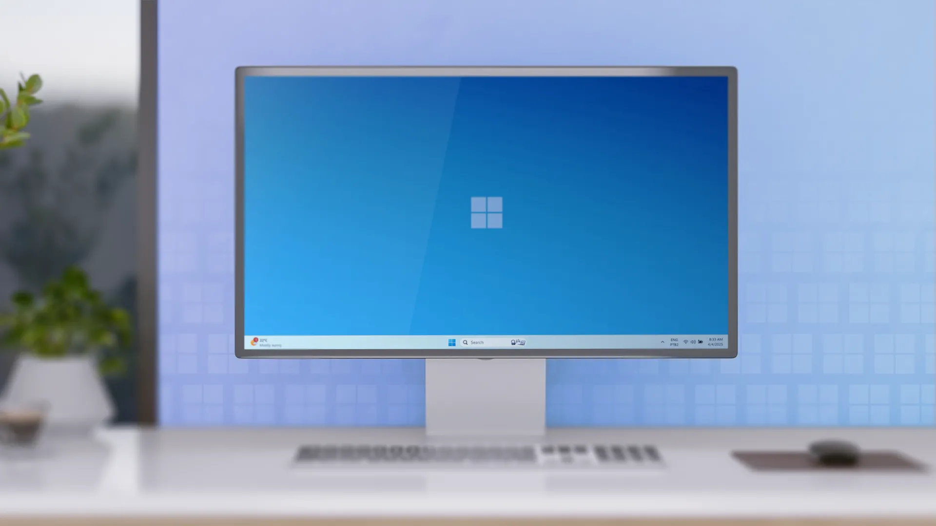 Bàn làm việc tối giản với máy tính để bàn chạy Windows 11, cho thấy sự gọn gàng dù hiển thị nhiều biểu tượng trên khay hệ thống.