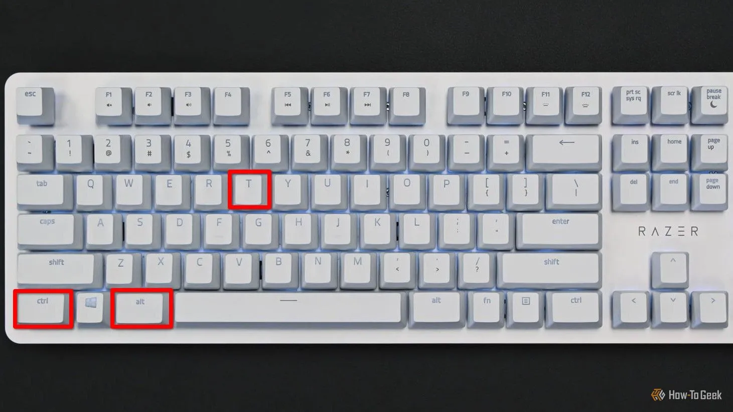 Bàn phím hiển thị phím Ctrl, Alt và T được tô đỏ, minh họa phím tắt mở nhanh cửa sổ Terminal trên Linux.