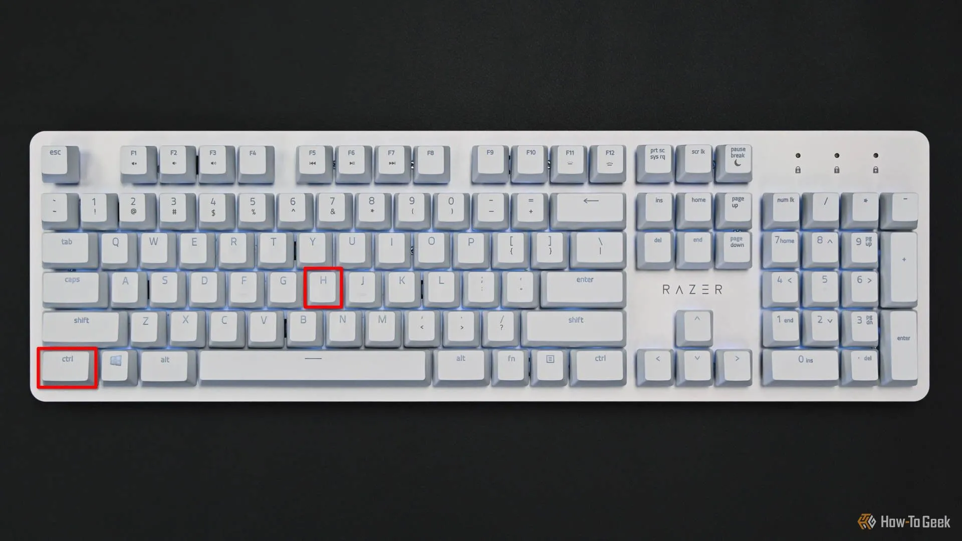 Bàn phím với các phím Ctrl và H được đánh dấu đỏ, minh họa phím tắt hiển thị thư mục ẩn trong trình quản lý tệp Dolphin