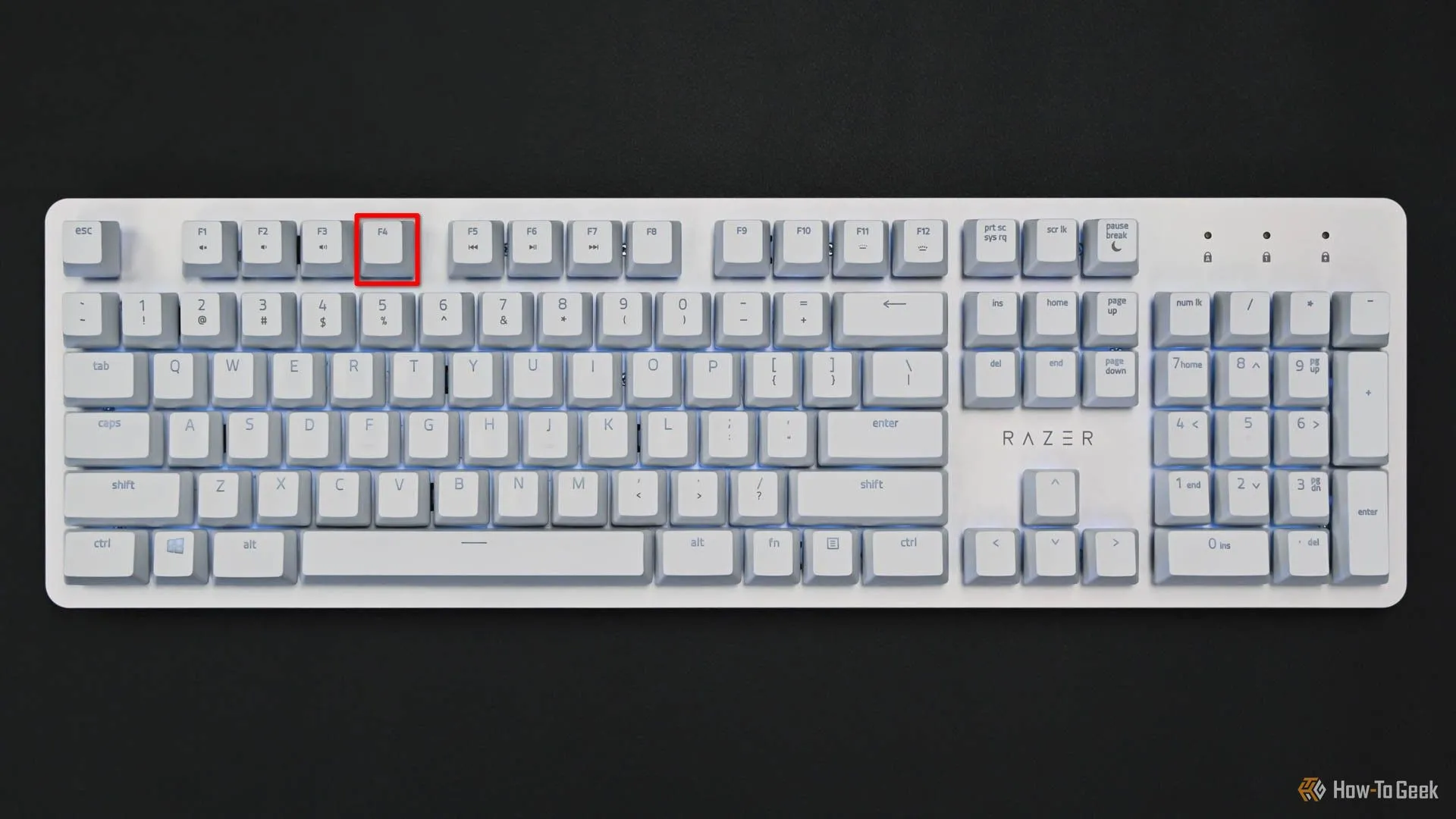 Bàn phím với phím F4 được đánh dấu đỏ, biểu thị phím tắt mở terminal mini trong Dolphin