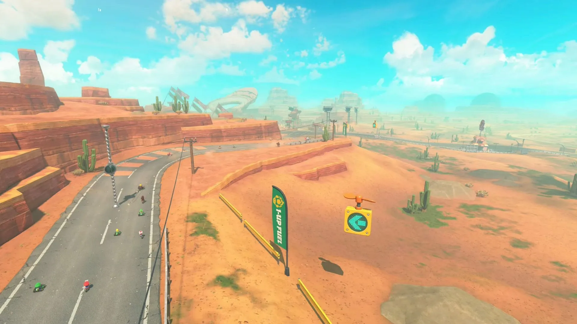 Cảnh quan đường đua sa mạc rộng lớn nhìn từ trên cao trong Mario Kart World