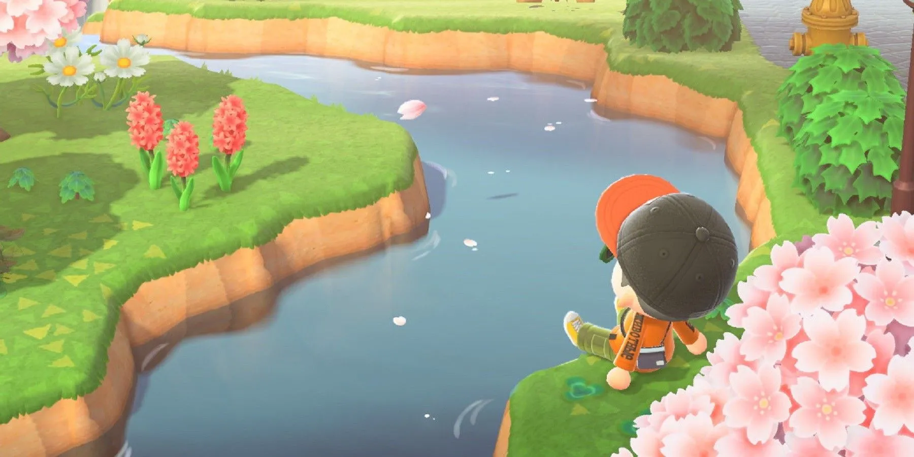 Cảnh sông suối và cây cối xanh tươi trên hòn đảo của người chơi trong Animal Crossing: New Horizons.