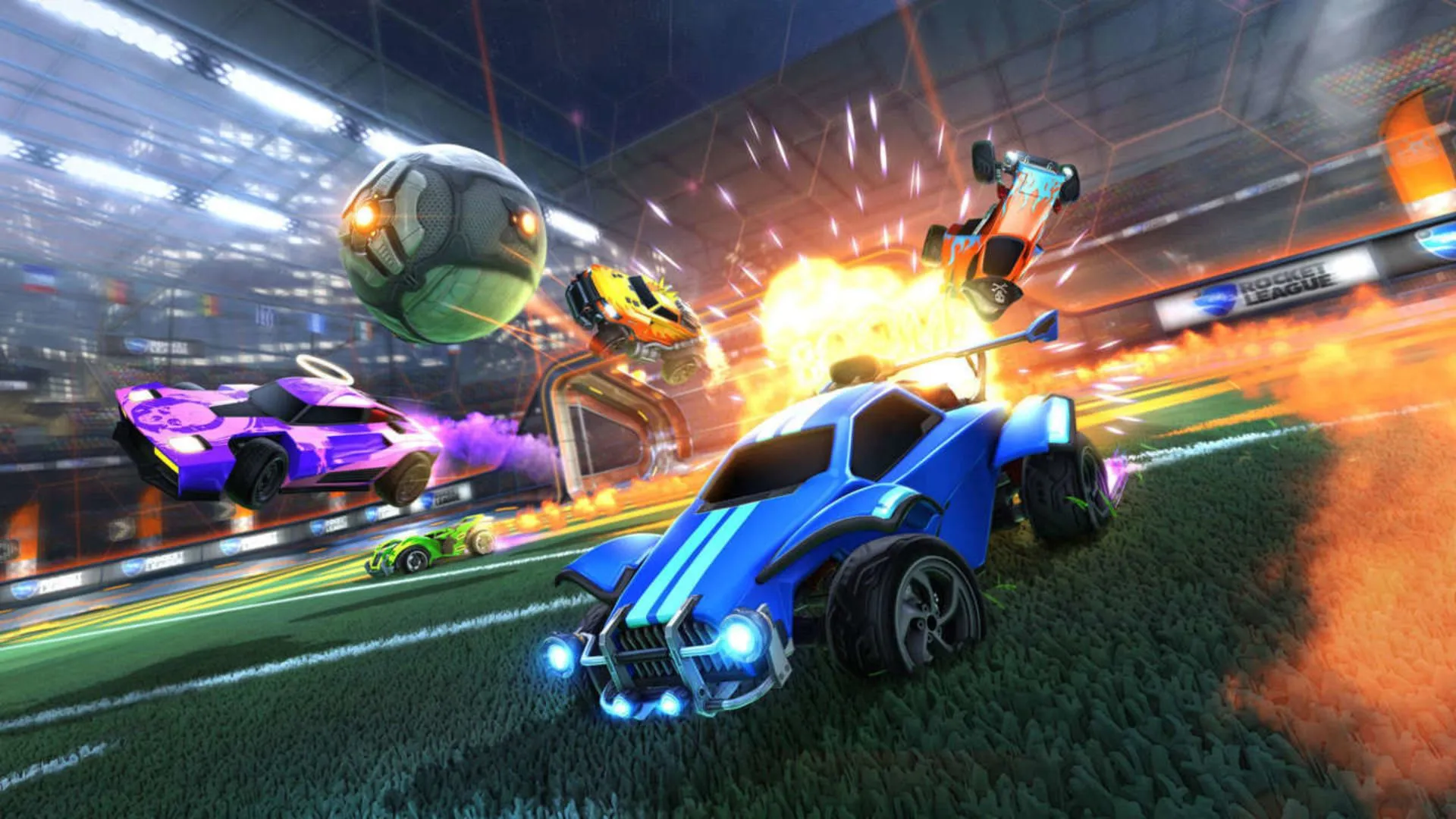 Cảnh tượng hỗn loạn nhưng kịch tính của ô tô và quả bóng bay trên không trong game thể thao Rocket League.