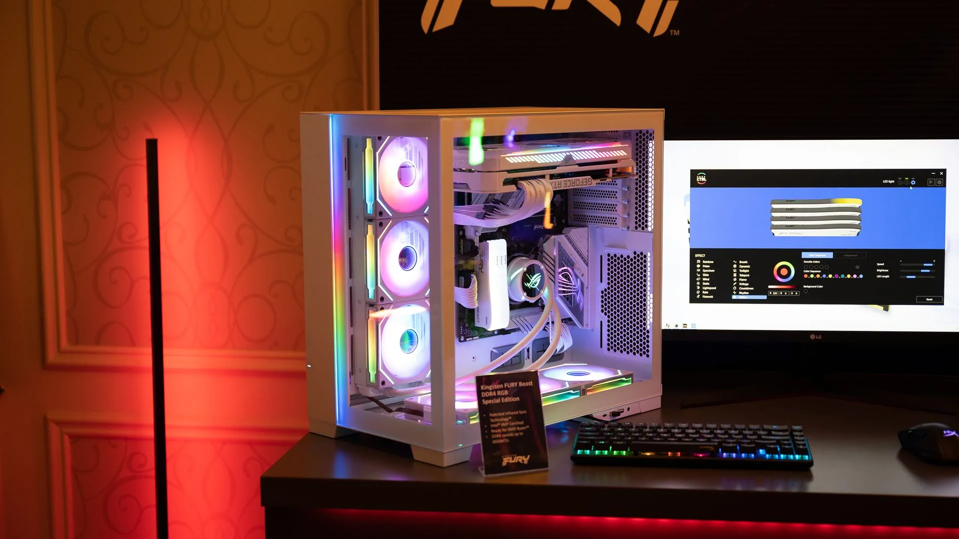 Một bộ PC gaming hiện đại với bộ nhớ Kingston, các quạt RGB sáng rực, tản nhiệt CPU MSI và card đồ họa GeForce RTX, hiển thị nội thất bên trong.