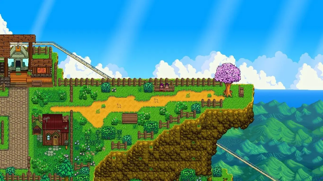Hai nhân vật trong Stardew Valley ngồi trên quảng trường đỉnh núi của Ridgeside Village, có thể đi lên bằng cáp treo