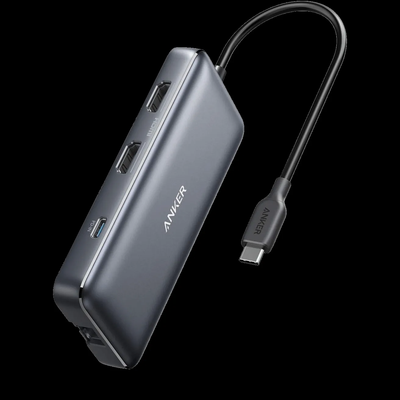 Anker 553, một hub USB-C màu xám với nhiều cổng kết nối, đặt trên bề mặt màu tối.
