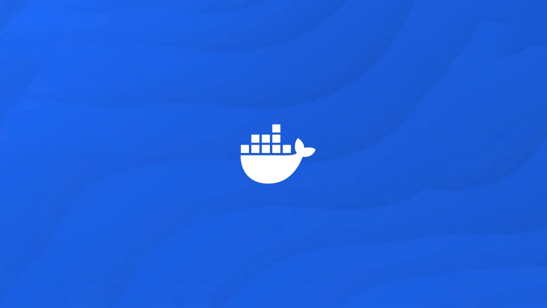 Logo Docker màu trắng trên nền xanh đặc trưng, biểu tượng cho công nghệ container hóa hiện đại.